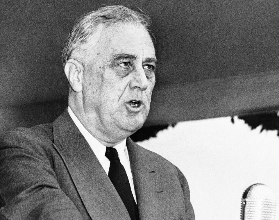 FILE - In this April 13, 1943 black-and-white file photo, President Franklin Delano Roosevelt speaks in Washington. Sen. Elizabeth Warren’s plan to pay for “Medicare for All” without raising middle-class taxes departs from the shared responsibility the U.S. traditionally has required for bedrock programs. That’s different from the “social insurance” idea of Democratic presidents like Franklin D. Roosevelt, Harry Truman and Lyndon Baines Johnson. They relied on broad-based taxes packaged as “contributions,” fostering a sense of ownership. (AP Photo/Robert Clover, File)