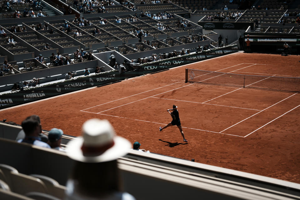 Spectators watch Russia's Veronika Kudermetova playing Russia's Daria Kasatkina during their quarterfinal match of the French Open tennis tournament at the Roland Garros stadium Wednesday, June 1, 2022 in Paris. (AP Photo/Thibault Camus)