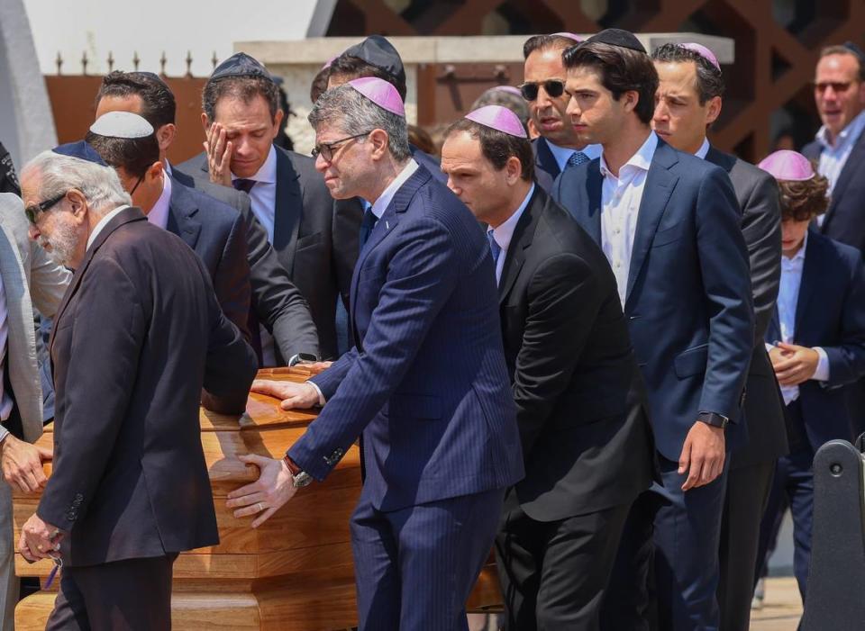 Pallbearers of male family members and friends roll the casket of Ransom Everglades student Ella Riley Adler at a funeral service for her at Temple Beth Sholom on Monday, May 13, 2024, in Miami Beach, Florida.