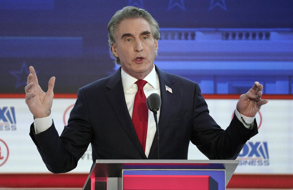 FILE - Republican presidential candidate North Dakota Gov. Doug Burgum speaks during a debate, Sept. 27, 2023, in Simi Valley, Calif. In some cases, Donald Trump's potential vice presidential contenders have had to abandon long-held policy positions and recant vehement criticism. In a July interview, Burgum, a businessman, was asked if he'd ever do business with Trump, and responded, "I don't think so." He added, "I just think that it's important that you're judged by the company you keep." (AP Photo/Mark J. Terrill, File)