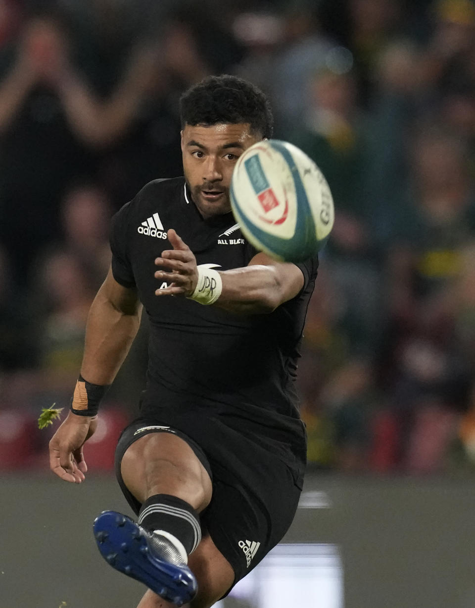 New Zealand's Richie Mo'unga kicks the winning penalty during the Rugby Championship test between South Africa and New Zealand at Ellis Park Stadium in Johannesburg, South Africa, Saturday, Aug. 13, 2022. (AP Photo/Themba Hadebe)