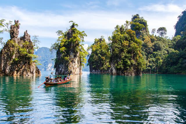 <p>Pakin Songmor/Getty Images</p> Beautiful view in Ratchprapha Dam in Khao Sok National Park.