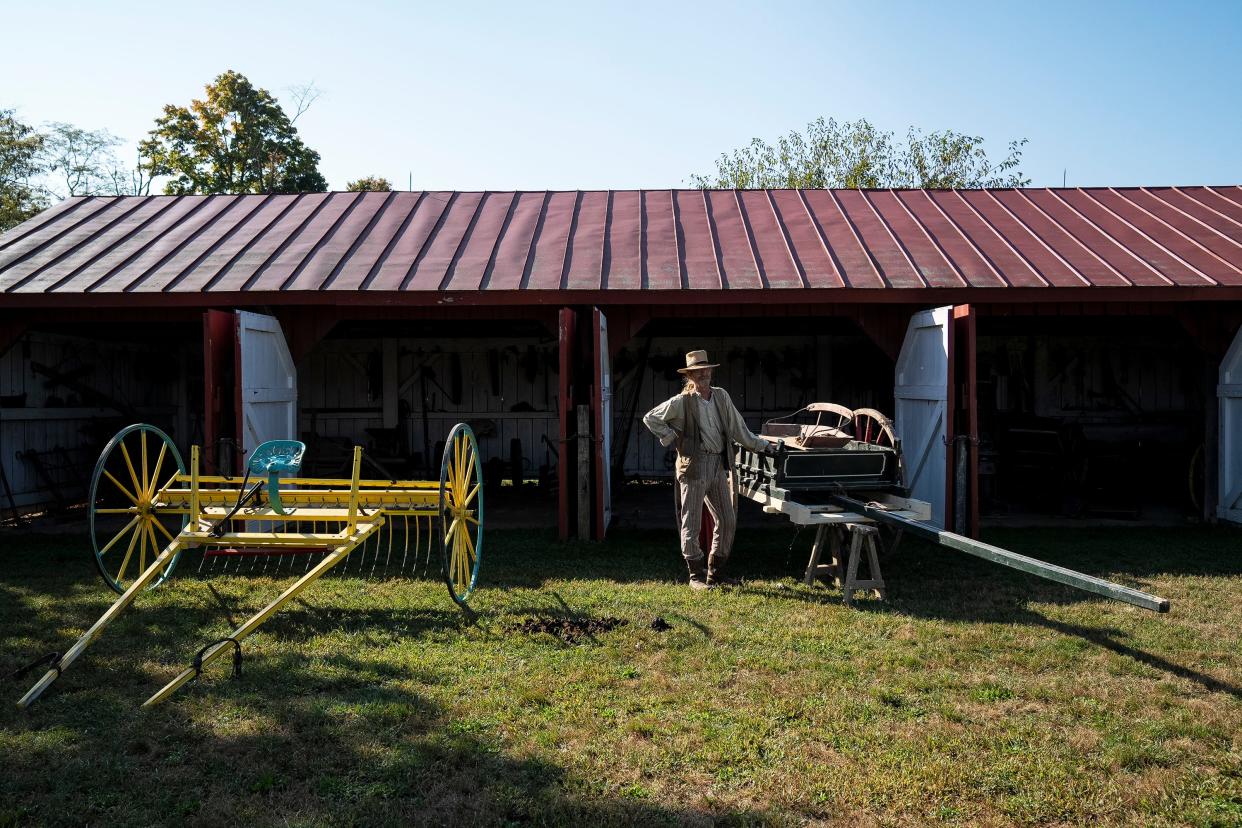 Oct 3, 2023; Columbus, Ohio, USA; Dave Trotter, a Historical Farmer, readies the carriages to be used for pumpkin farming at Slate Run Living Historical Farm. The Park features a variety of activities in the month of October including a lesson on the uses of apples, an evening on the farm and teachings on victorian curiosities.