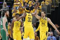 Apr 19, 2019; Indianapolis, IN, USA; Indiana Pacers center Myles Turner (33) receives a high five from forward Bojan Bogdanovic (44) during the third quarter in game three of the first round of the 2019 NBA Playoffs against the Boston Celtics at Bankers Life Fieldhouse. Mandatory Credit: Brian Spurlock-USA TODAY Sports