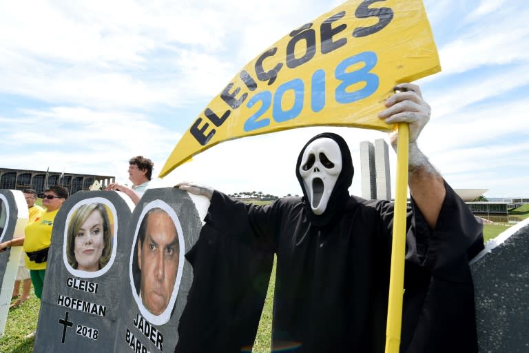 Protester attend a rally against corruption in Brasilia on March 26, 2017