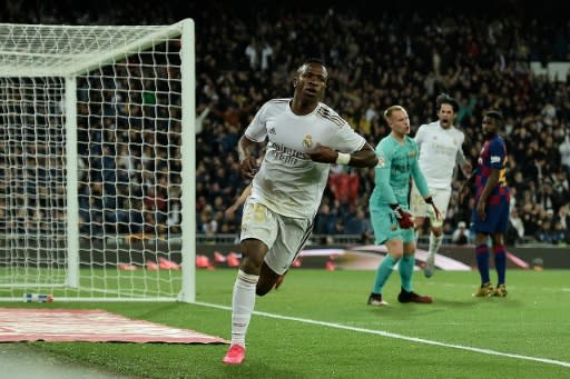 Real Madrid's Brazilian forward Vinicius Junior celebrates after scoring against Barcelona