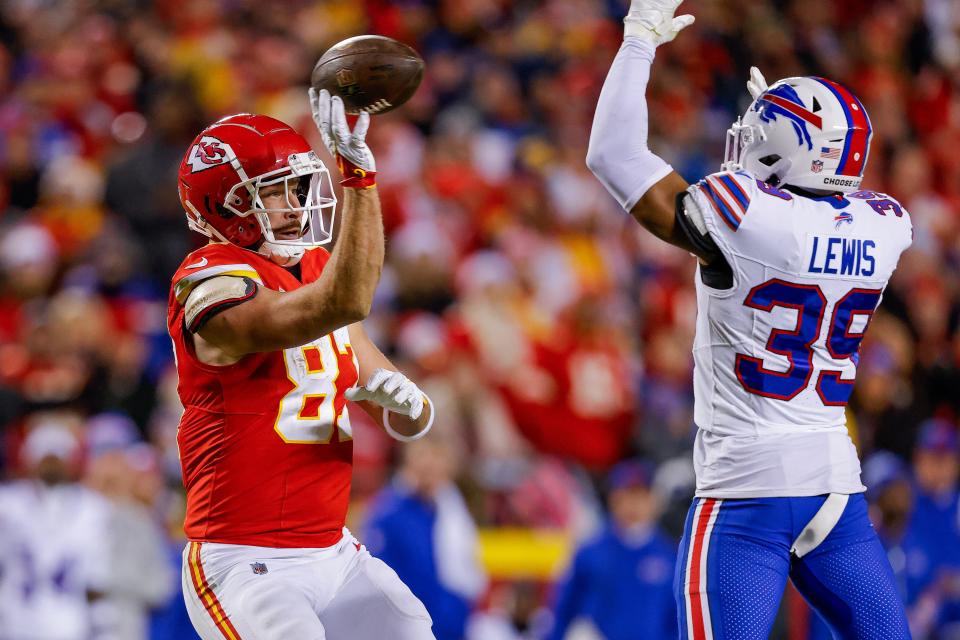 KANSAS CITY, MISSOURI - DECEMBER 10: Travis Kelce #87 the Kansas City Chiefs passes the ball after catching a pass during the second half of the game against the Buffalo Bills at GEHA Field at Arrowhead Stadium on December 10, 2023 in Kansas City, Missouri. (Photo by David Eulitt/Getty Images)
