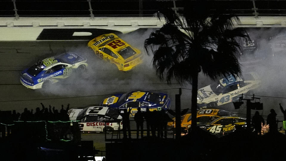 Daniel Suarez (99), and Joey Logano (22) crash during the NASCAR Daytona 500 auto race Monday, Feb. 19, 2024, at Daytona International Speedway in Daytona Beach, Fla. (AP Photo/Chris O'Meara)