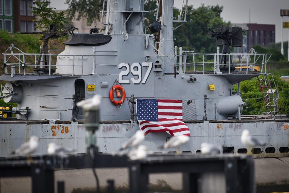 Seagulls line up in the foreground near the the USS Ling, a 312-foot long, 2,500-ton submarine veteran of World War II, which now rests on the silty bottom of Hackensack River. Photographed on 08/10/21.