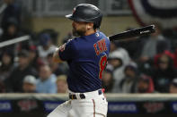 Minnesota Twins' Jake Cave watches an RBI single against the Los Angeles Angels during the sixth inning of a baseball game Friday, Sept. 23, 2022, in Minneapolis. The Angels won 4-2. (AP Photo/Bruce Kluckhohn)