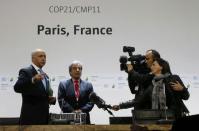 French Minister of Foreign Affairs Laurent Fabius, President-designate of COP21, (L) and Peru's Minister of Environment Manuel Pulgar Vidal talk to a tv crew as they visit a conference room on the site of the World Climate Change Conference 2015 (COP21) in Le Bourget, near Paris, France, November 29, 2015. REUTERS/Jacky Naegelen