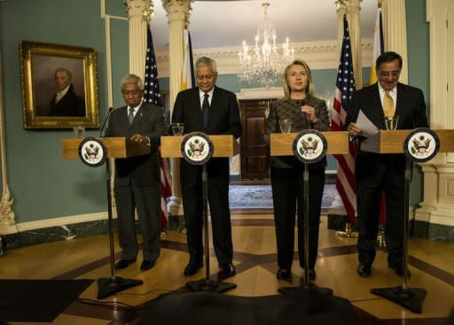 From left: Philippine's Secretary of National Defense Voltaire Gazmin, Philippine's Foreign Affairs Secretary Albert Del Rosario, US Secretary of State Hillary Clinton and US Secretary of Defense Leon Panetta arrive for a press conference at the US State Department in Washington, DC