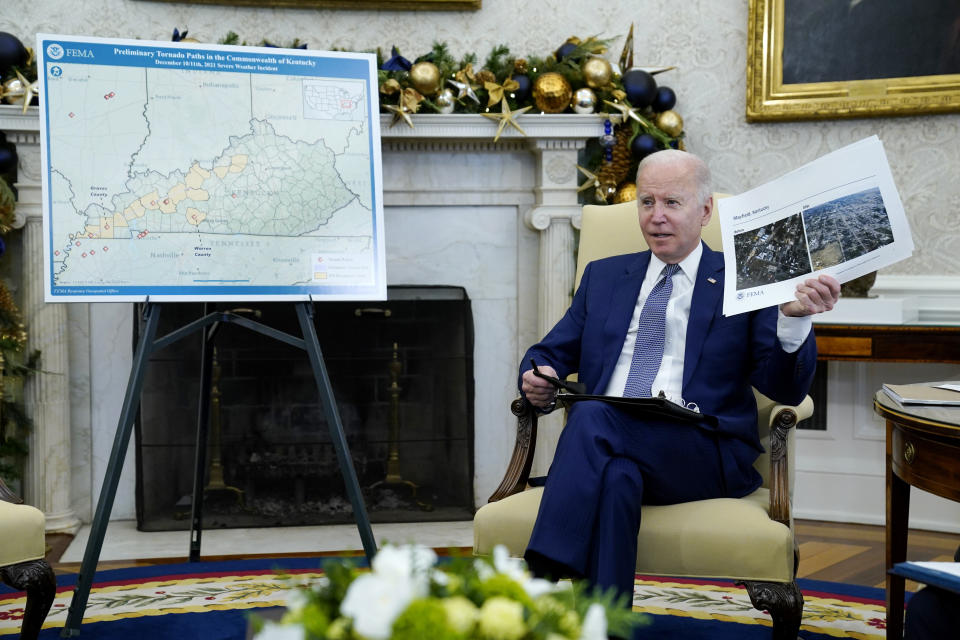 President Joe Biden participates in a briefing with Homeland Security Secretary Alejandro Mayorkas on the federal response to tornado damage, in the Oval Office of the White House, Monday, Dec. 13, 2021, in Washington. (AP Photo/Evan Vucci)