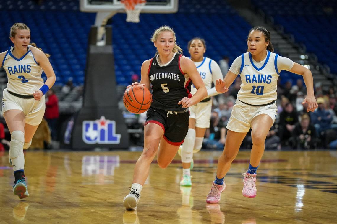 Shallowater’s Maggie Grimes (5) races down court ahead of Emory Rains defenders Jaycee Phillips (10) and Caroline Piles (3) in a Class 3A state semifinal on Thursday, February 29, 2024 at the Alamodome in San Antonio, Texas. The Lady Cats were chasing Shallowater all game as the Fillies stunned No. 3 Rains 59-47. Whitney Magness/University Interscholastic League