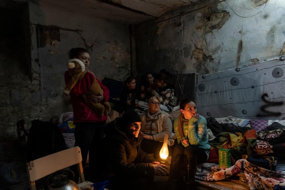Janna Goma, right, with her family settle in a bomb shelter in Mariupol, Ukraine, Sunday, March 6, 2022. Associated Press photographer Evgeniy Maloletka won the World Press Photo Europe Stories Award with this image which was part of a series of images titled The Siege of Mariupol, and won the World Press Photo of the Year award on Thursday, April 20, 2023, for his harrowing image of emergency workers carrying a pregnant woman through the shattered grounds of a maternity hospital in the Ukrainian city of Mariupol in the chaotic aftermath of a Russian attack.