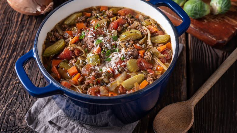 stew in pot with wooden spoon