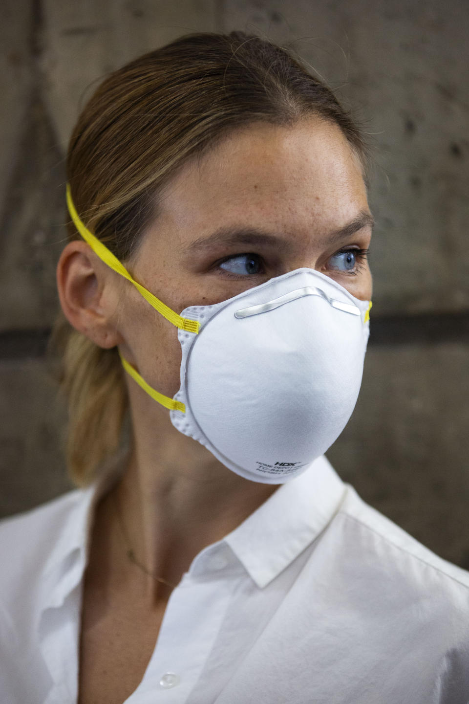 Israeli top model Bar Refaeli wears a face mask as she arrives to a court, in Tel Aviv, Israel, Monday, July 20, 2020. Refaeli signed a plea bargain agreement with authorities to settle a long-standing tax evasion case against her and her family. The deal will require Refaeli to serve nine months of community service while her mother, Zipi, will be sent to prison for 16 months. The two are also ordered to pay a $1.5 million fine on top of millions of back taxes owed to the state. (AP Photo/Oded Balilty, Pool)