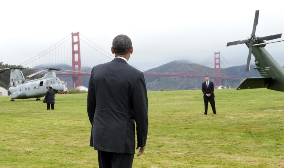 President Barack Obama looks at the Golden Gate bridge before getting on Marine One in San Francisco, Thursday, April 4, 2013. Obama will be attending Democratic fundraisers while in California. (AP Photo/Susan Walsh)