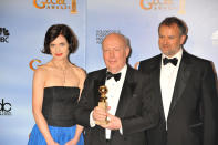 (L-R) Actress Elizabeth McGovern, writer-producer Julian Fellowes and actor Hugh Bonneville pose in the press room at the 69th Annual Golden Globe Awards held at the Beverly Hilton Hotell. (Photo by Frank Trapper/Corbis via Getty Images)