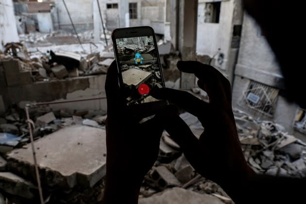 A Pokémon Go player in the besieged Syrian town of Douma captures a Pokémon on July 23, 2016. See more from our look back at the year in photos <a href="https://www.theatlantic.com/photo/2016/12/2016-the-year-in-photos-may-august/509522/" rel="nofollow noopener" target="_blank" data-ylk="slk:here;elm:context_link;itc:0;sec:content-canvas" class="link ">here</a>.