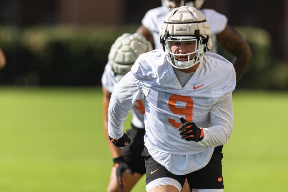 OSU defensive end Brock Martin (9) runs drills during practice at Sherman Smith Center on Aug. 3.