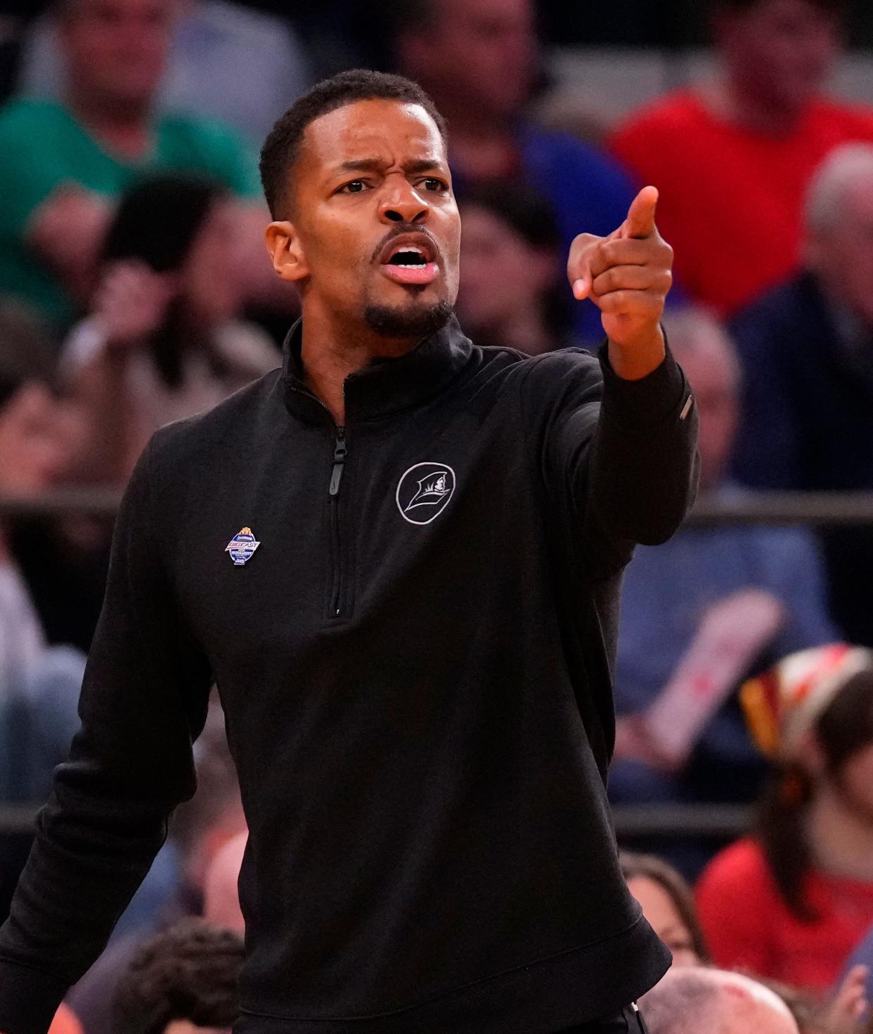 Providence head coach Kim English shouts out instructions to his team during its game against Marquette in the Big East Tournament. On Friday, PC announced that a year had been added to his contract.