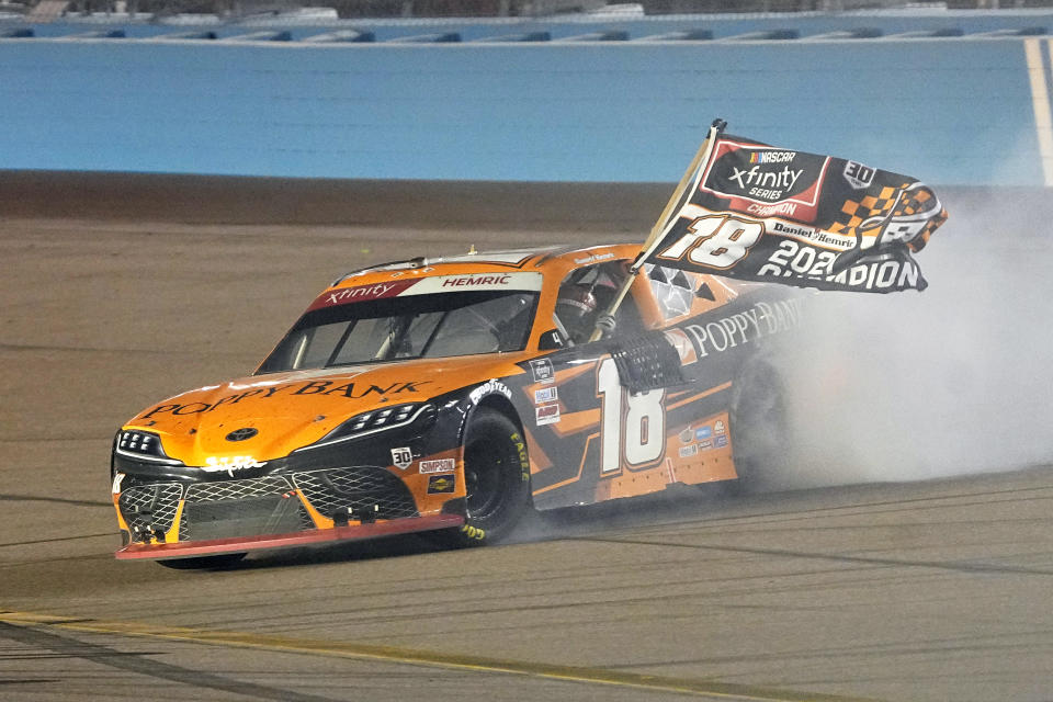 Daniel Hemric celebrates after winning the NASCAR Xfinity Series auto race Saturday, Nov. 6, 2021, in Avondale, Ariz. Hemric won the season title. (AP Photo/Rick Scuteri)