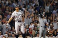 New York Yankees' Giancarlo Stanton watches his grand slam during the eighth inning of a baseball game against the Boston Red Sox, Saturday, Sept. 25, 2021, in Boston. (AP Photo/Michael Dwyer)