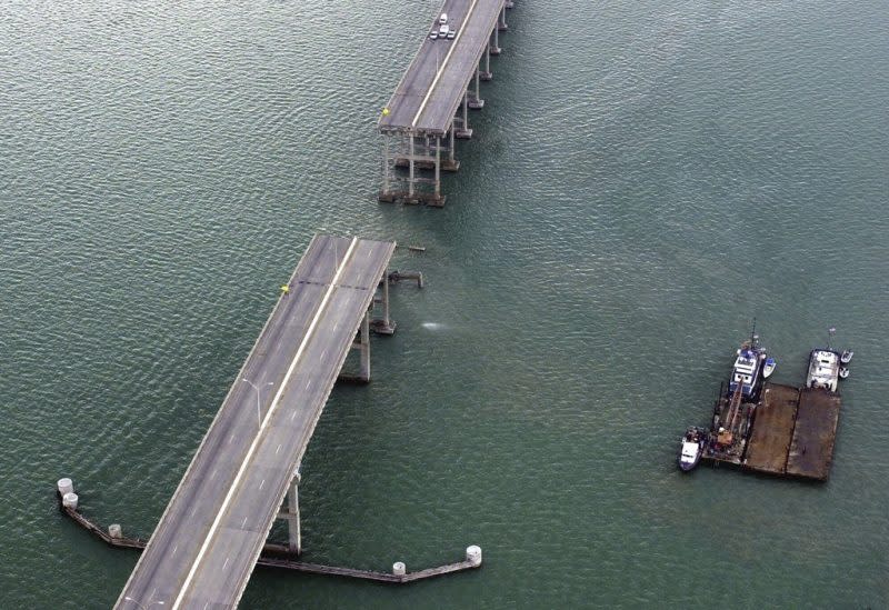 A section of the Queen Isabella Causeway is shown missing as crews break from their search and rescue due to a storm in Port Isabella, Texas on Saturday, Sept. 15, 2001. (AP Photo/Eric Gay, File)