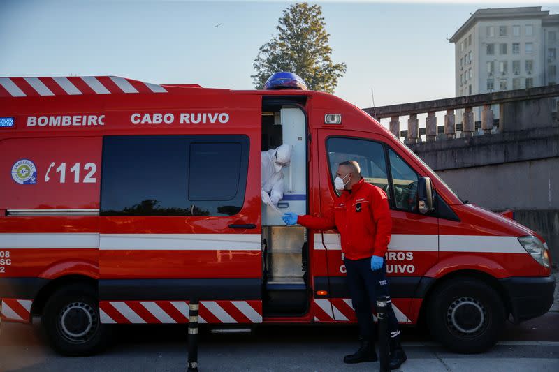 An ambulance carrying a COVID-19 patient is seen outside Santa Maria Hospital, during the coronavirus disease (COVID-19) pandemic in Lisbon