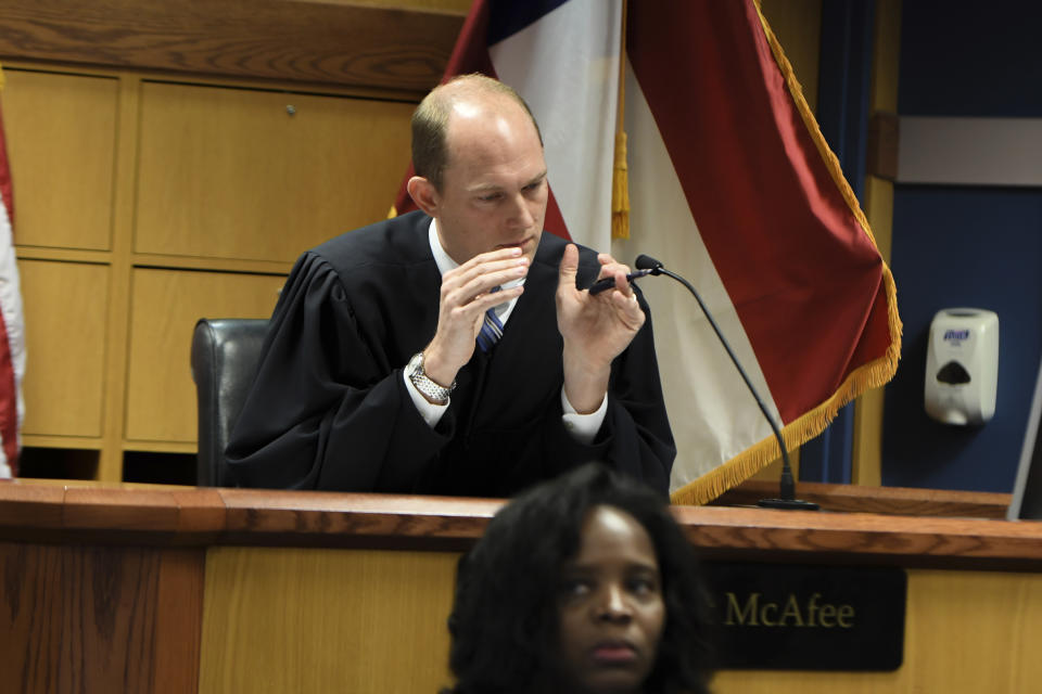 Judge Scott McAfee addresses the lawyers during a hearing on charges against former President Donald Trump in the Georgia election interference case on Thursday, March 28, 2024 in Atlanta. Lawyers for Trump argued in a court filing that the charges against him in the Georgia election interference case seek to criminalize political speech and advocacy conduct that is protected by the First Amendment. (Dennis Byron/Hip Hop Enquirer via AP)