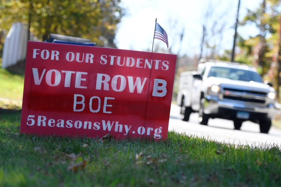 A sign opposed to critical race theory is posted on Tuesday, Oct. 19, 2021, ahead of the Nov. 2 school board elections in Guilford, Conn.