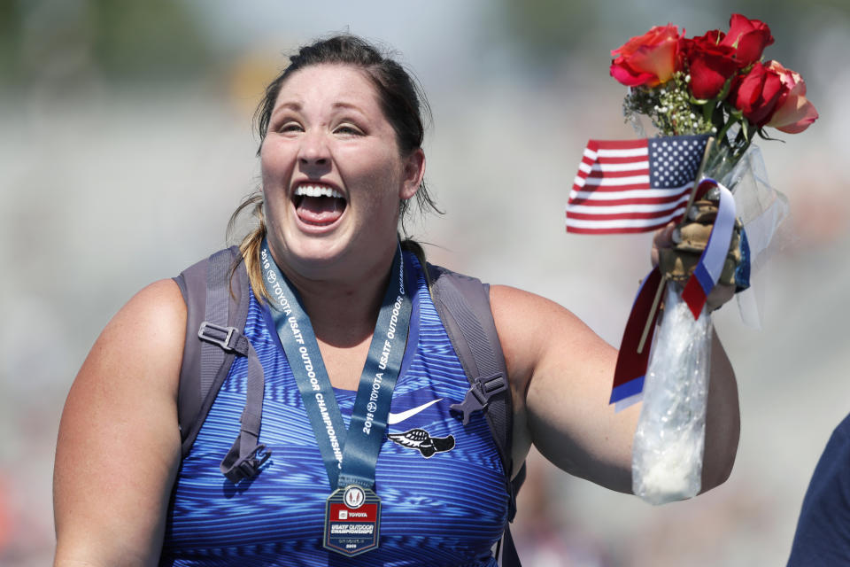 DeAnna Price reacts to the crowd after receiving her medal for winning the women's hammer throw at the U.S. Championships athletics meet, Saturday, July 27, 2019, in Des Moines, Iowa. (AP Photo/Charlie Neibergall)