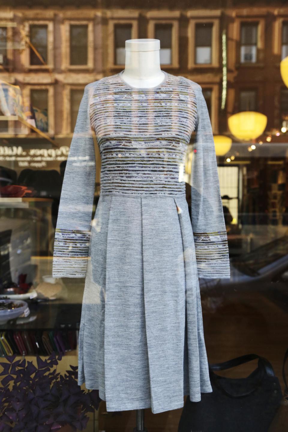 A dress hangs in a women's clothing store in the Park Slope neighborhood in the Brooklyn borough of New York that Mayor-elect Bill de Blasio calls home, Thursday, Nov. 14, 2013. Now de Blasio faces a crucial early decision: should he leave Park Slope behind to move to the mayor’s official residence, stately Gracie Mansion on Manhattan’s Upper East Side? (AP Photo/Mark Lennihan)