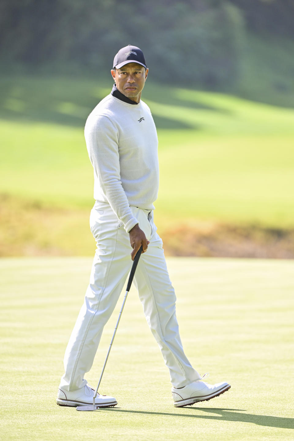 PACIFIC PALISADES, CALIFORNIA - FEBRUARY 15:  Tiger Woods reads his putt on the eighth hole green during the first round of The Genesis Invitational at Riviera Country Club on February 15, 2024 in Pacific Palisades, California. (Photo by Ben Jared/PGA TOUR via Getty Images)