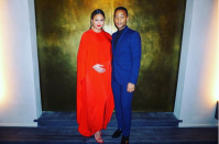 <p>Cute! Chrissy and John share a full-length snap with Chrissy holding her bump in a stunning red gown paired with red stilettos.</p>