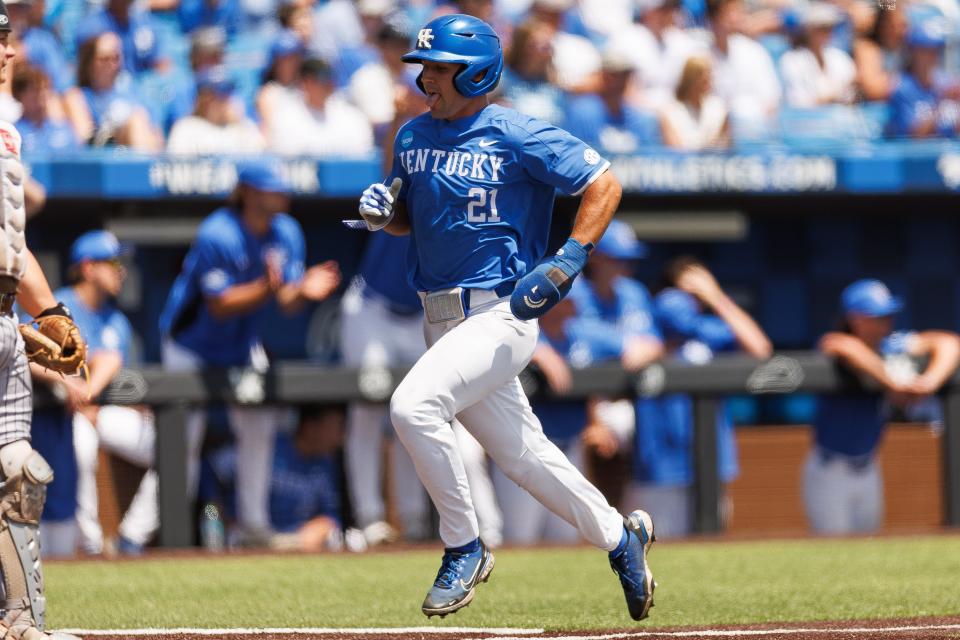 May 31, 2024;  Lexington, KY, USA;  Kentucky outfielder Ryan Waldschmidt (21) runs home and scores in the first inning of an NCAA Division I baseball championship game between the Kentucky Wildcats and Western Michigan Broncos at Kentucky Proud Park.  Mandatory Credit: Jordan Prather-USA TODAY Sports