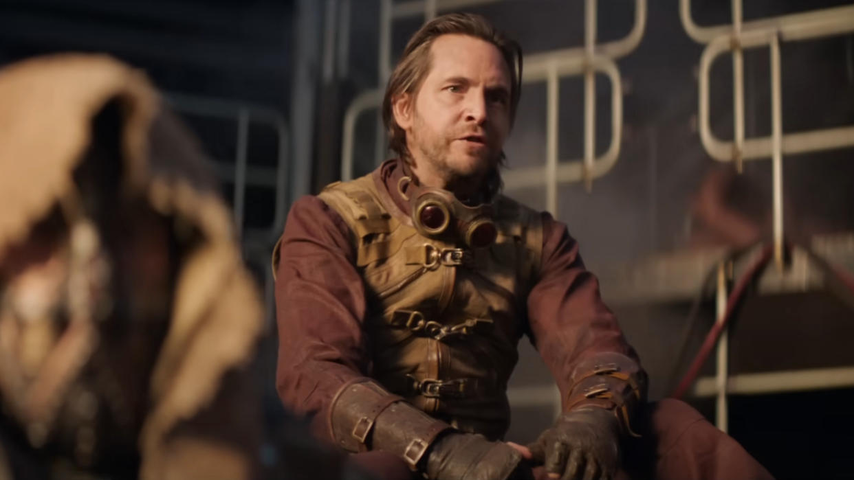  Aaron Stanford sits fired up in Deadpool & Wolverine. 