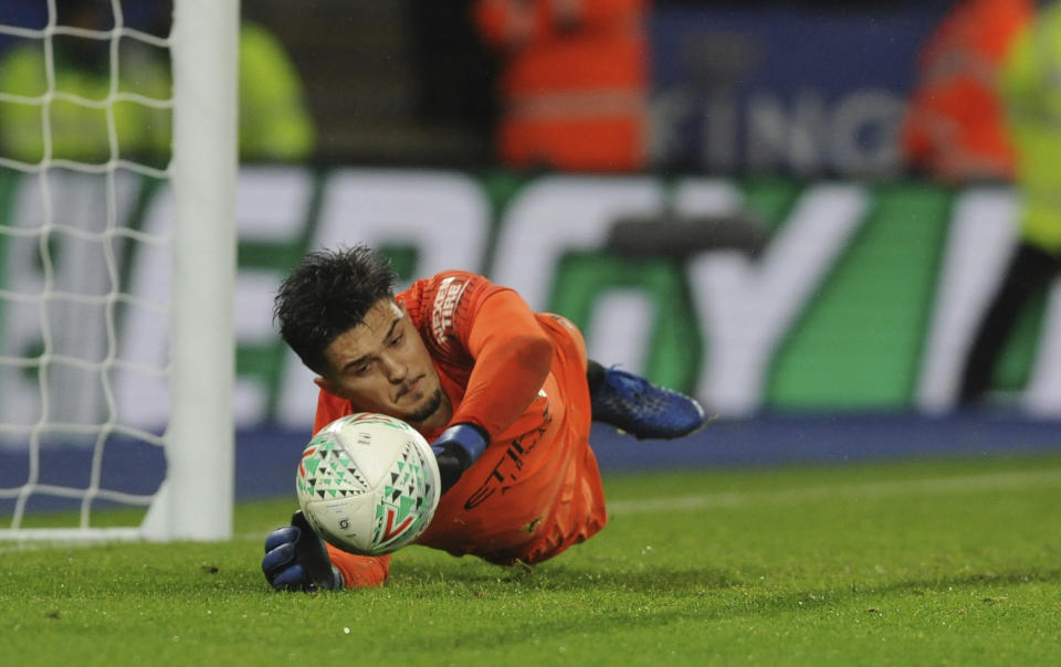 Manchester City's goalkeeper Arijanet Muric saves a penalty from Leicester City's Caglar Soyuncu during a penalty shoot out during the English League Cup quarterfinal soccer match at the King Power stadium in Leicester, England, Tuesday, Dec.18, 2018. Manchester City won 3-1 in a penalty shoot out after the match ended in a 1-1 draw in normal time. (AP Photo/Rui Vieira)