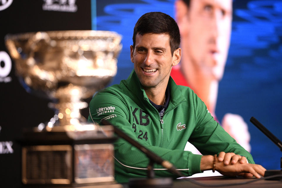 Serbia's Novak Djokovic addresses a press conference after defeating Austria's Dominic Thiem to win the men's singles final at the Australian Open tennis championship in Melbourne, Australia, Monday, Feb. 3, 2020. (AP Photo/Andy Brownbill)