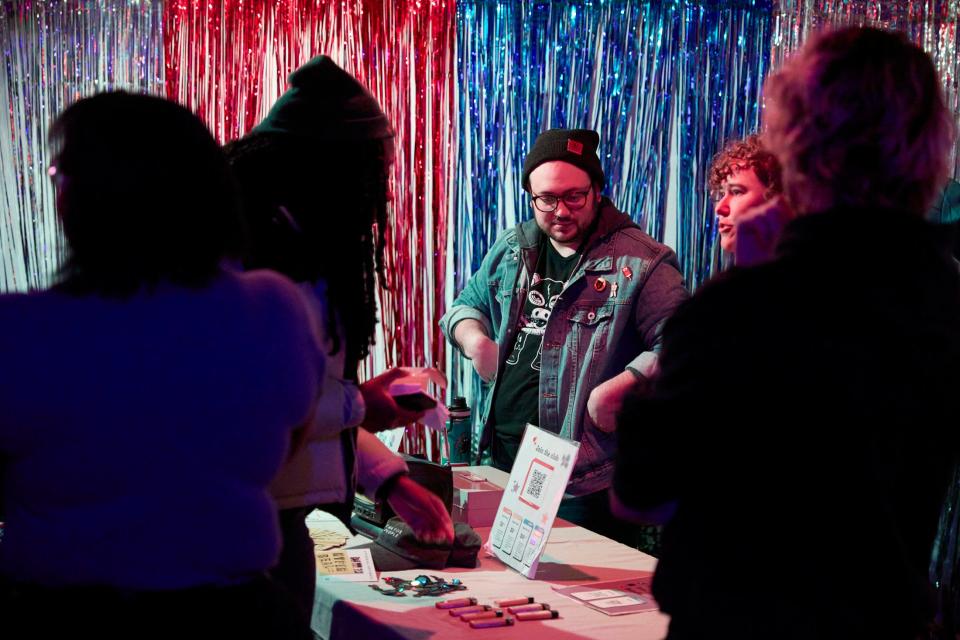 Volunteers James Scott and Bailey Moore work the Hyperreal Film Club merch table on Nov. 14 at Hotel Vegas.