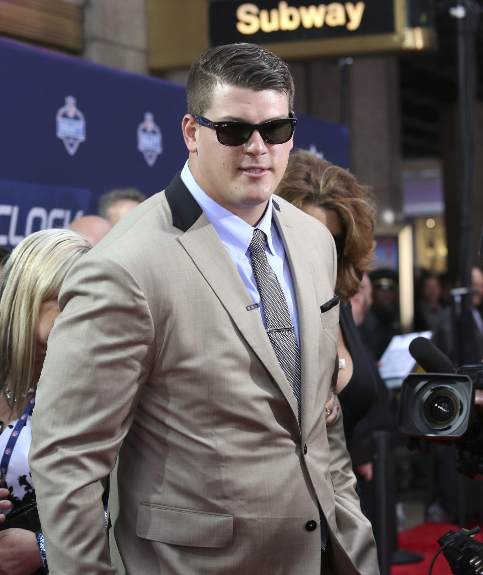 Michigan tackle Taylor Lewan arrives for the first round of the 2014 NFL Draft at Radio City Music Hall, Thursday, May 8, 2014, in New York. (AP Photo/Craig Ruttle)