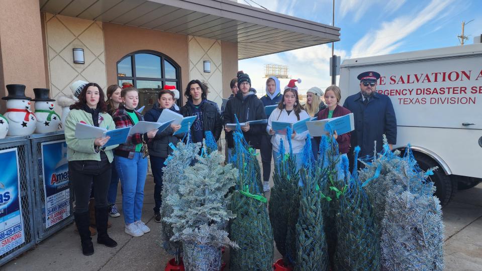 The Amarillo High School New Sound Singers sing a Christmas Carol at United Supermarkets Saturday during the Salvation Army's Red Kettle kick-off event in southwest Amarillo.