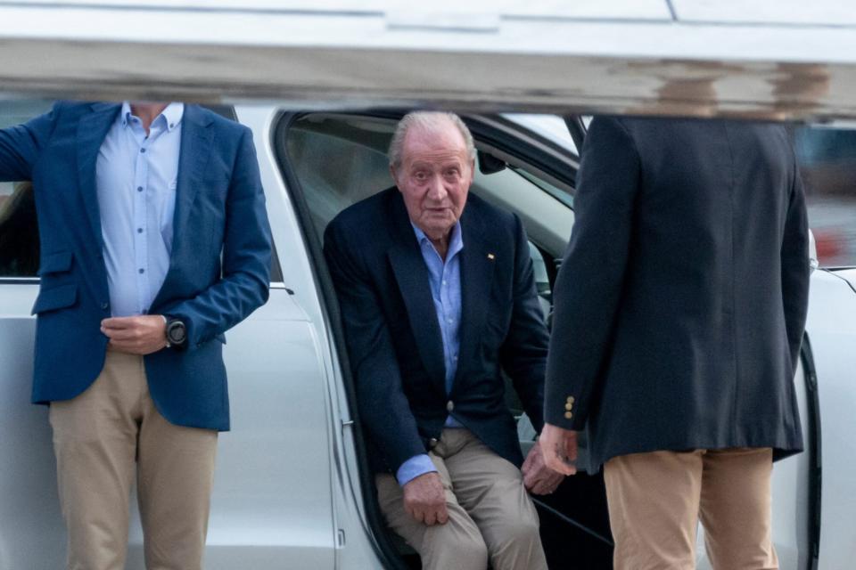 Spain's former King Juan Carlos I sits in a car after landing by a private jet at the Peinador airport in Vigo, Pontevedra, on May 19, 2022, before heading to the northwestern resort of Sanxenxo to attend a three-day regatta. - After nearly two years in exile in the United Arab Emirates following a string of financial scandals, Spain's former king makes his first trip home on May 19, 2022, on a brief visit that has sparked widespread criticism. (Photo by Brais Lorenzo / AFP) (Photo by BRAIS LORENZO/AFP via Getty Images)