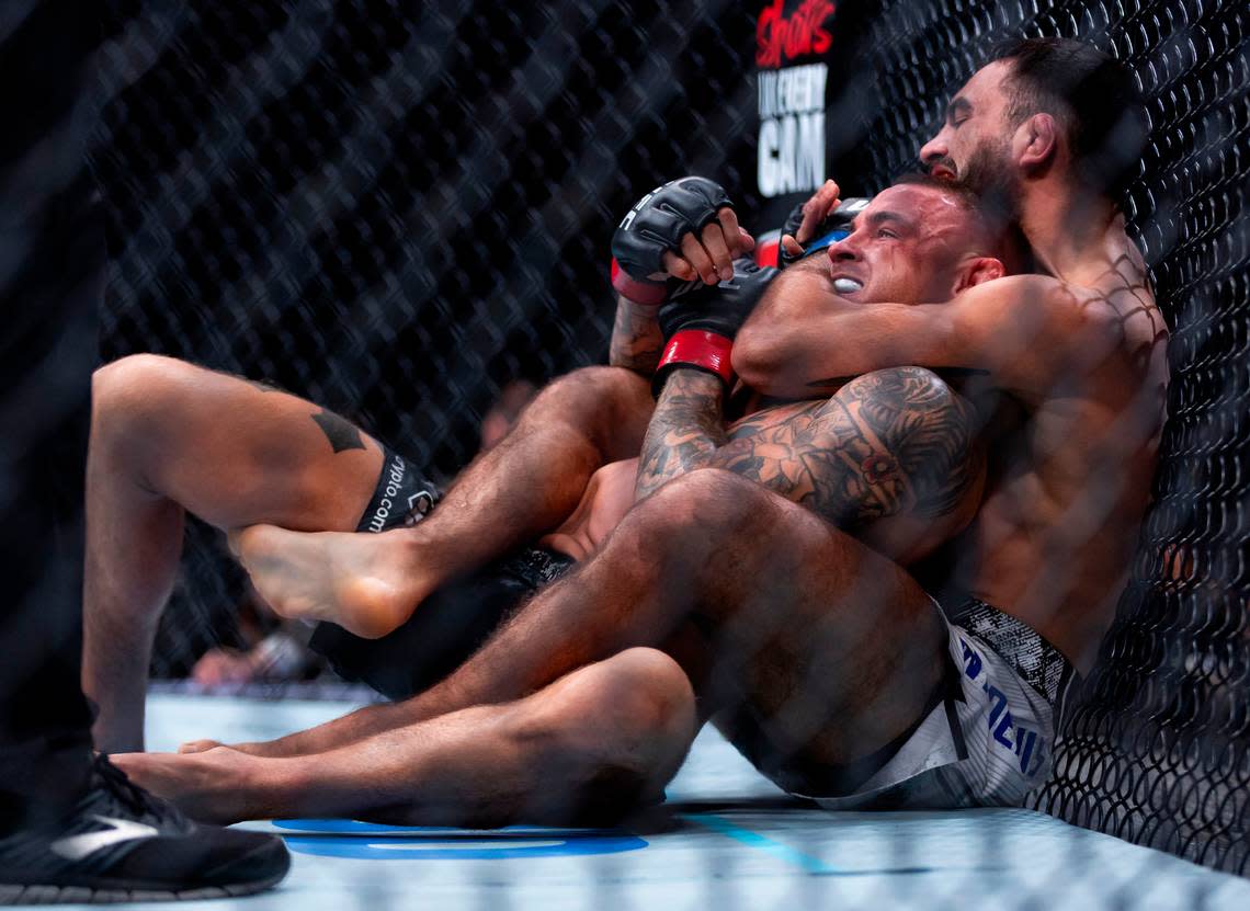 Dustin Poirier of the United States fights against Benoit Saint Denis of France during their lightweight title match during the UFC 299 event at the Kaseya Center on Saturday, March 9, 2024, in downtown Miami, Fla.