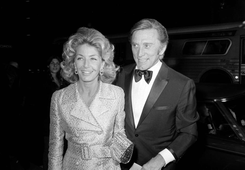 FILE - This Nov. 5, 1971 file photo shows actor Kirk Douglas and his wife Anne at the premier of "Fiddler on the Roof" in Los Angeles. Kirk Douglas died Wednesday, Feb. 5, 2020 at age 103. (AP Photo/Harold Filan, File)