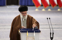 In this picture released by the official website of the office of the Iranian supreme leader, Supreme Leader Ayatollah Ali Khamenei casts his ballot in the parliamentary elections, in Tehran, Iran, Friday, Feb. 21, 2020. Iranians began voting for a new parliament Friday, with turnout seen as a key measure of support for Iran's leadership as sanctions weigh on the economy and isolate the country diplomatically. (Office of the Iranian Supreme Leader via AP)