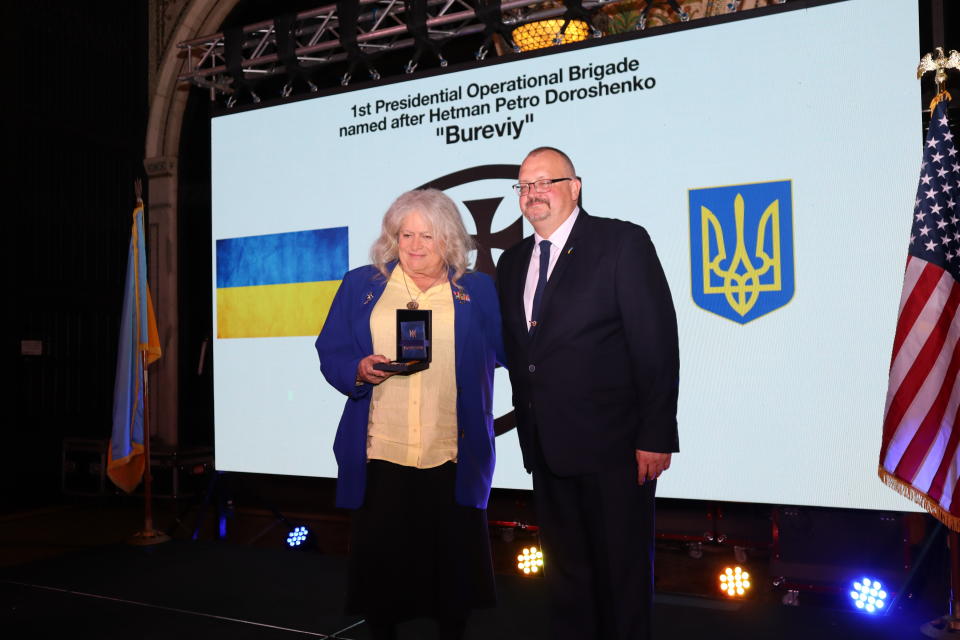 Lieutenant Colonel Jennifer N. Pritzker, IL ARNG (Retired), was presented with a Badge of Honor from the Ukrainian National Guard's Presidential Brigade.