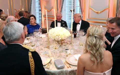 US President Donald Trump (R) and First Lady Melania Trump host a dinner at Winfield House for Prince Charles, Prince of Wales (C) and Camilla, Duchess of Cornwall, with White House Press Secretary Sarah Sanders (L) - Credit: Chris Jackson - WPA Pool/Getty Images