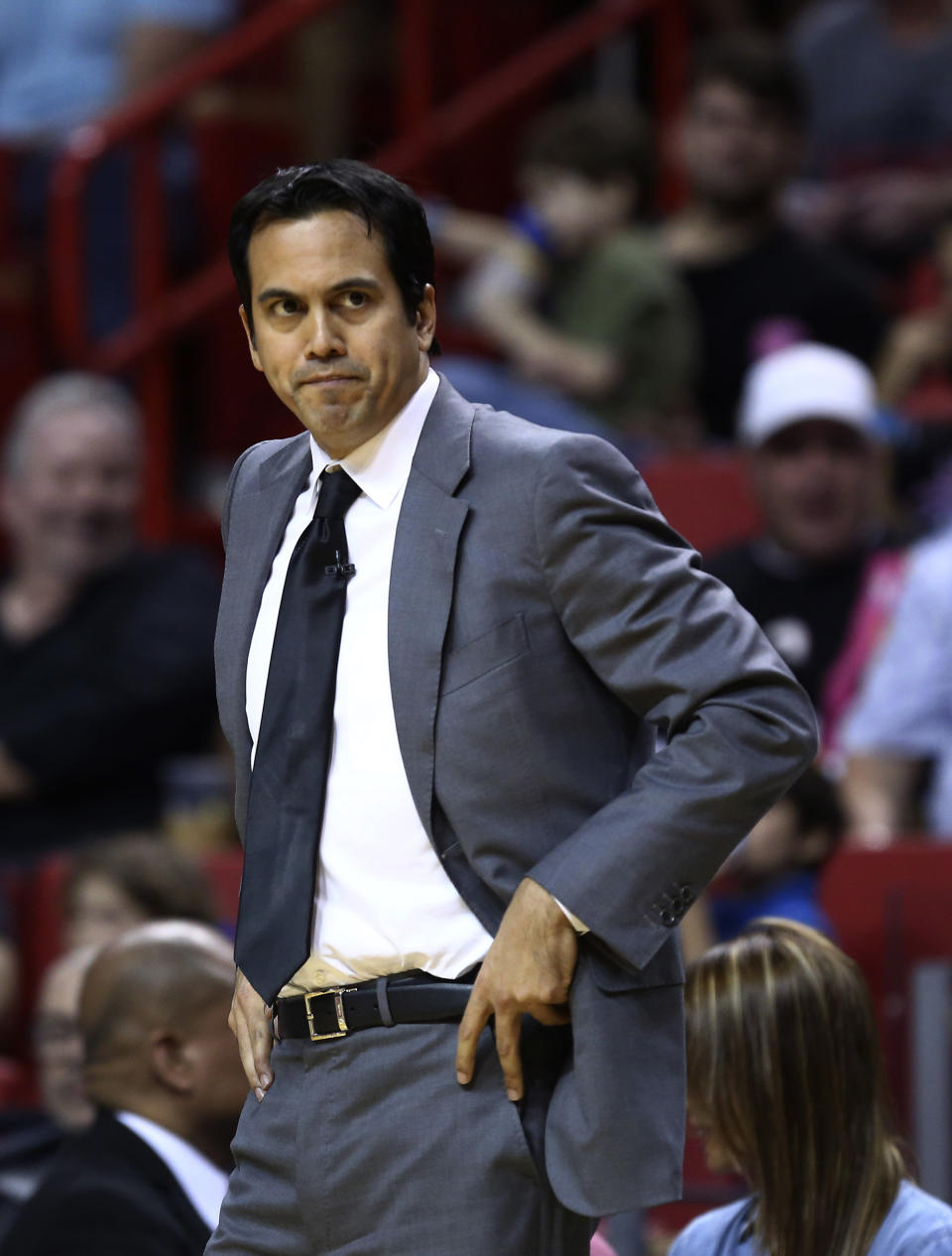 Miami Heat coach Erik Spoelstra watches game action against the San Antonio Spurs during the first half of a NBA basketball game in Miami, Sunday, Jan. 26, 2014. (AP Photo/J Pat Carter)